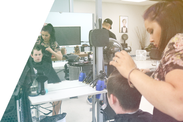 SGEI hairstyling student cutting a child's hair
