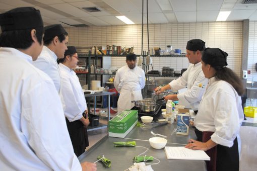 Instructor observes students in our line cook training program