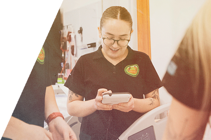 A practical nursing student checks vitals.