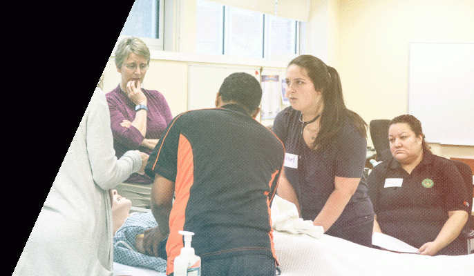 Student follow instructions during a hands-on lesson in Practical Nursing