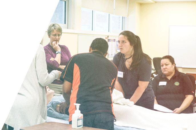 Student follow instructions during a hands-on lesson in Practical Nursing
