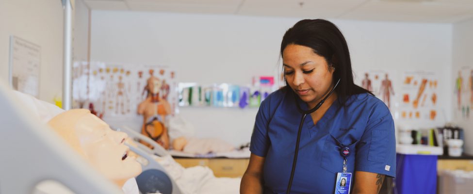 A health care student in a simulation lab