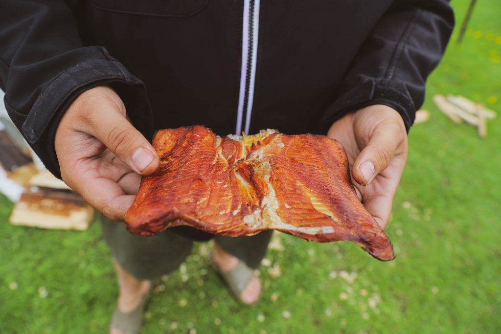 Man holding smoked fish