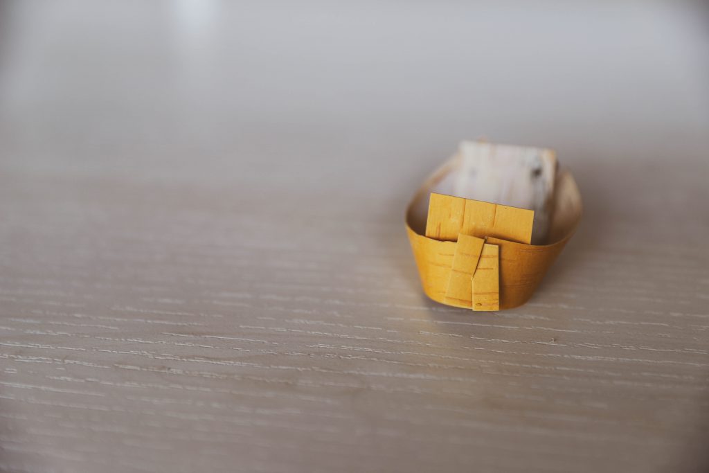 A piece of birch bark cut and folded into a traditional spirit dish