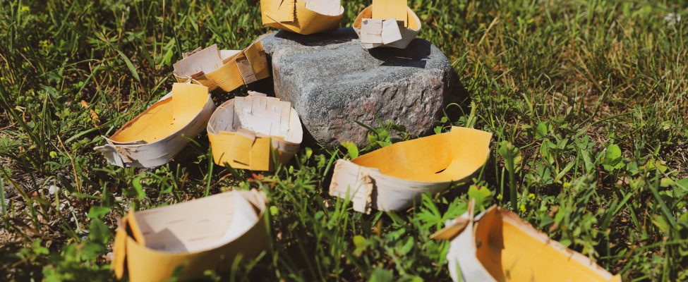 A collection of traditional Anishinaabe spirit dishes placed outside