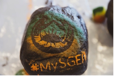A rock painted with a design