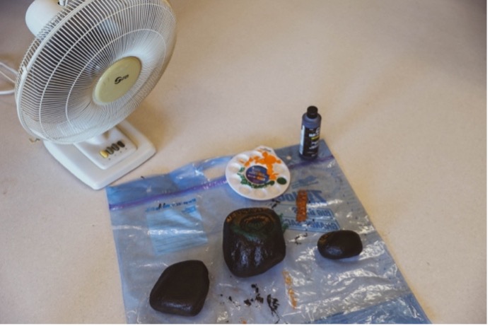 A group of rocks painted and drying