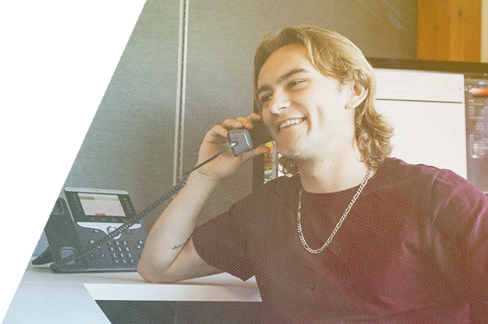 An employee talks on the phone.