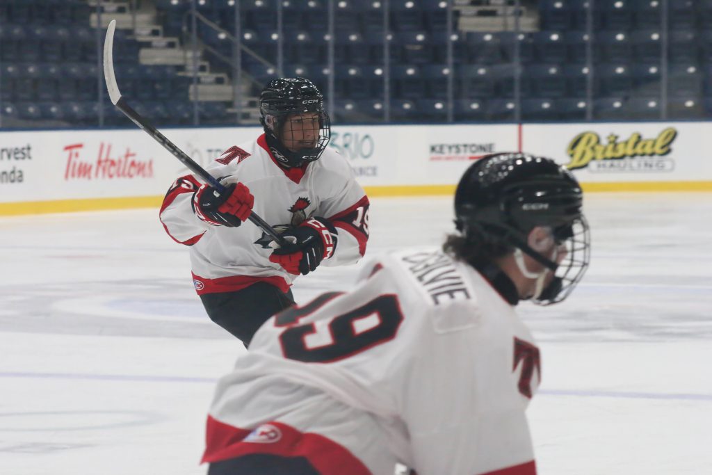 Thistles forward Manny Ross chases a puck.