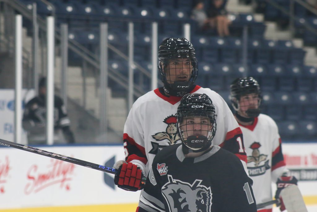 Thistles forward Manny Ross towers over an Eastman Selects player.