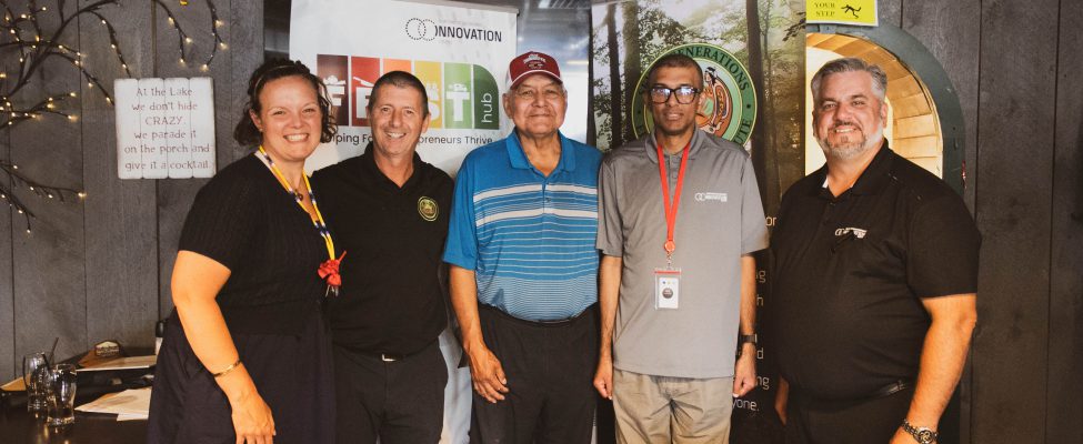SGEI and NOIC representatives smile after announcing their new partnership, FEAST.