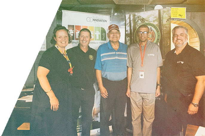 SGEI and NOIC representatives smile after announcing their new partnership, FEAST.