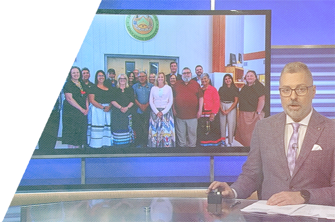 News anchor sits at desk with image of SGEI and Confederation College leadership in the background
