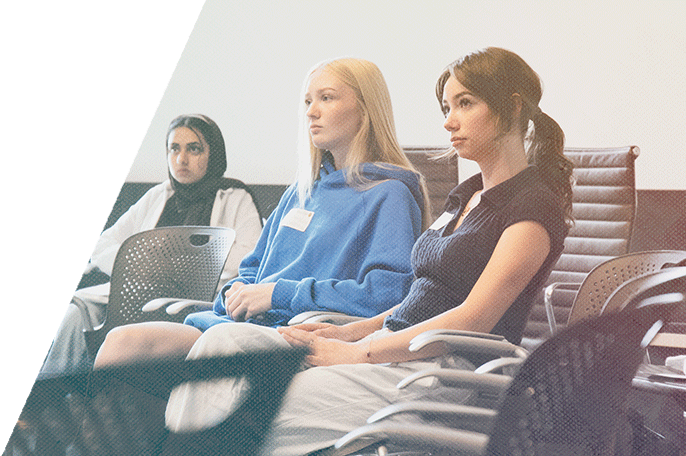 New SGEI students listen during orientation.